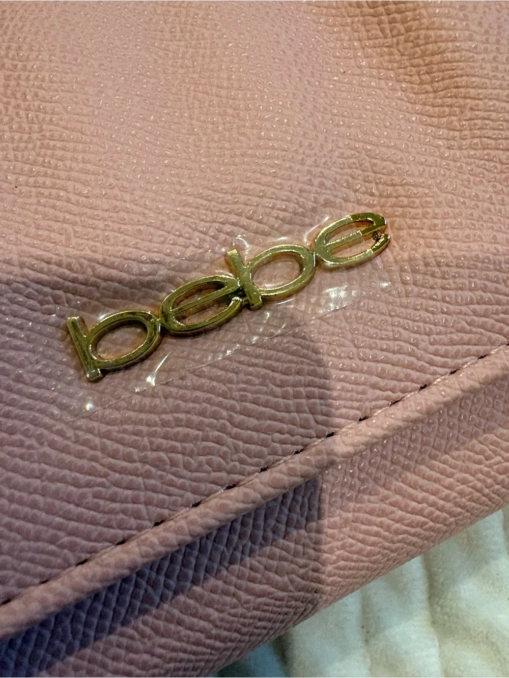 bebe Pale Pink Wristlet Clutch with Gold Logo